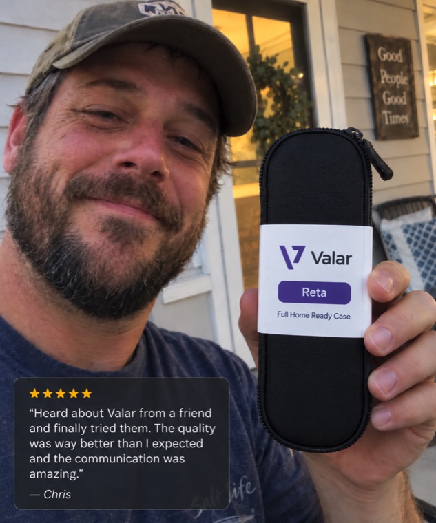Real customer holding a Valar case, five-star review